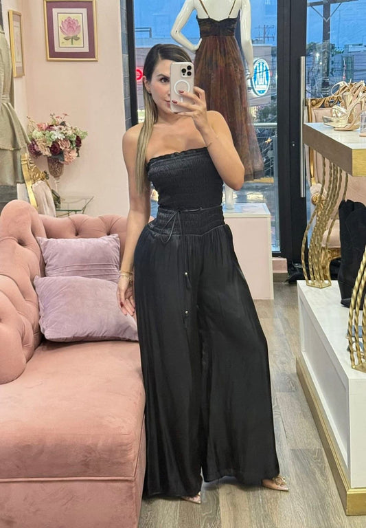 Palazzo negro strapless con pretina elástica y caída fluida